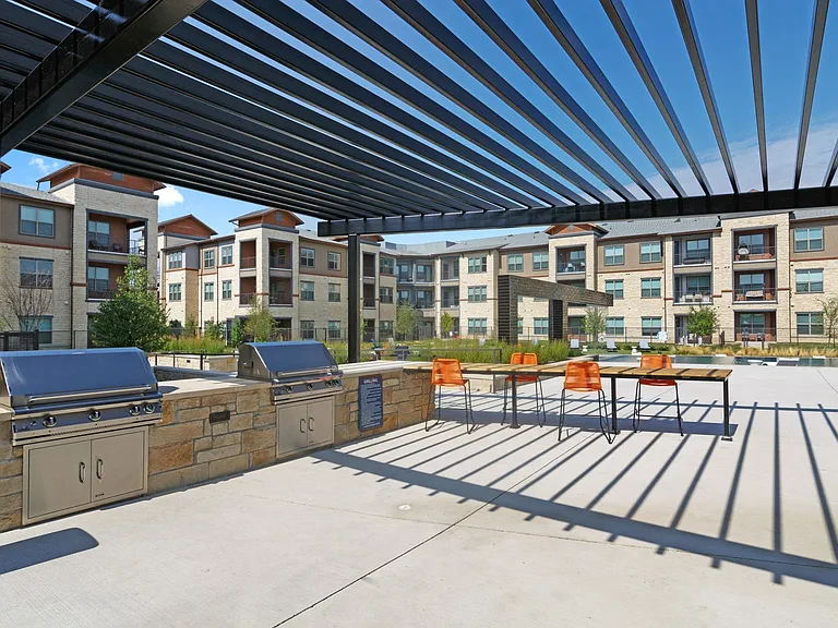 Outdoor entertainment space outfitted with grilling stations.