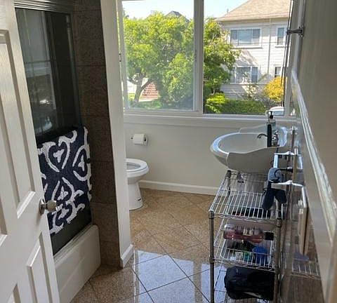 large bathroom with tub and shower