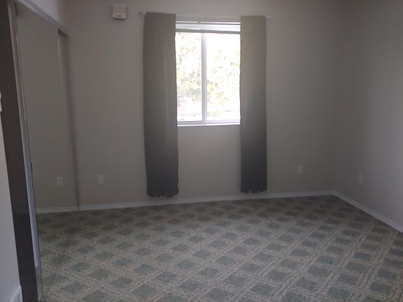Downstairs bedroom. Room measures 10 ft 7 inches x 14 foot 4 in.
