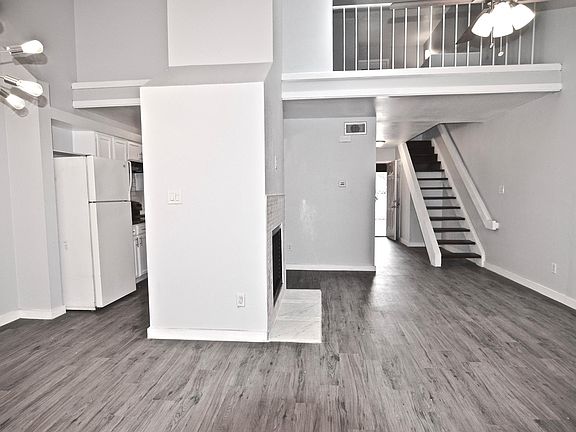 living room and dining showing the loft area