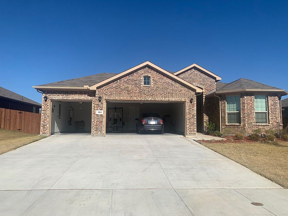 Front of The House & Three Car Garage