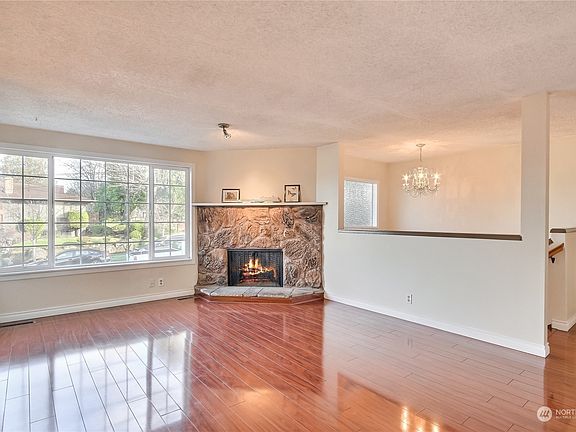 Living Room - Wood Burning Fireplace>