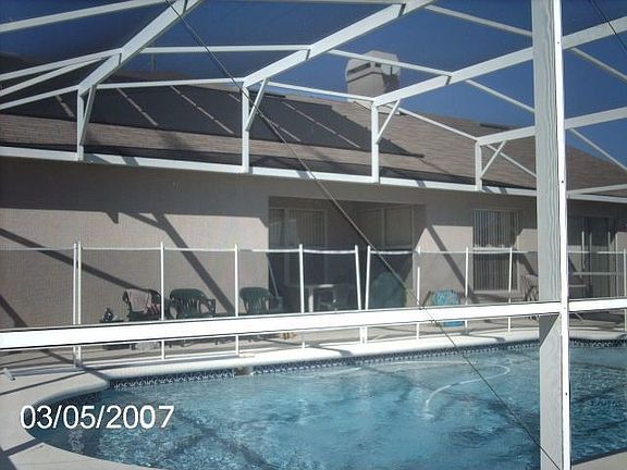 back showing pool (left) Solar Heated (see panels on roof)