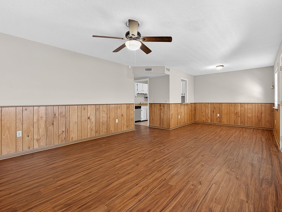 Living room/dining room combo with lots of natural light.