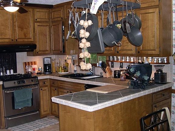 Kitchen with Tile Counters and Bkfst Area