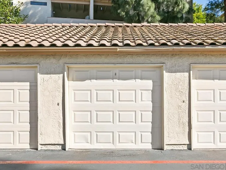 Condo's one-car garage (across from parking spot)