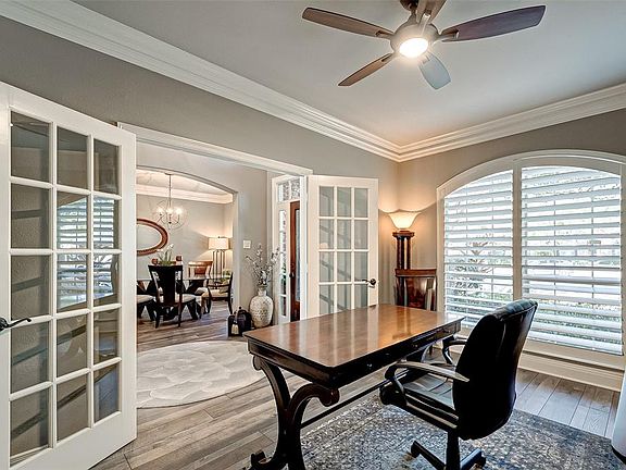 View from the office to the entry and dining room. Notice the French Doors.