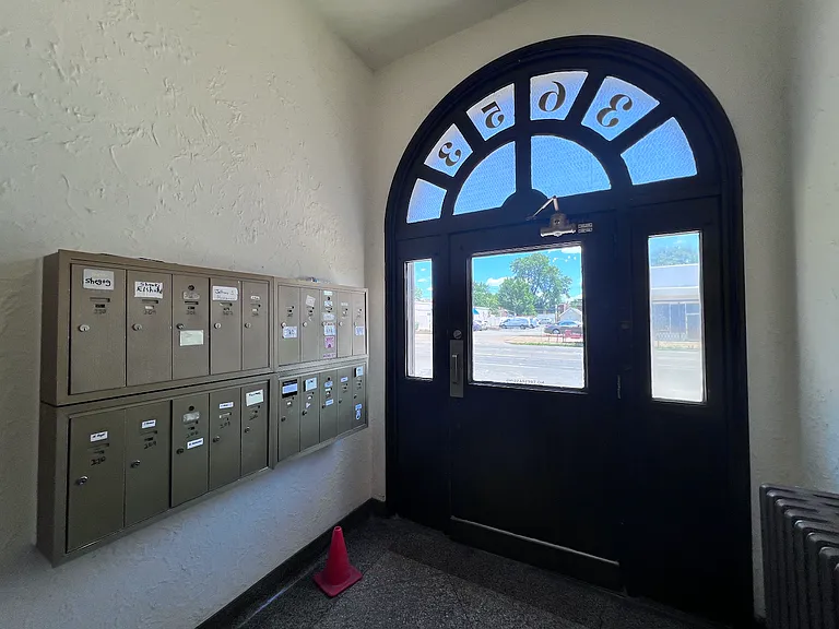 Mail boxes are located next to entrance on Grand.