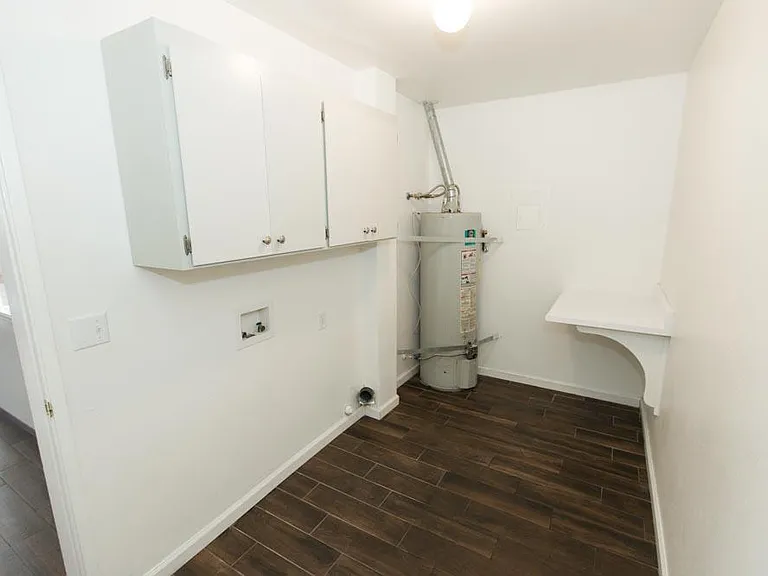 Separate laundry room with cabinets.
Electric Washer/Dryer hookups.