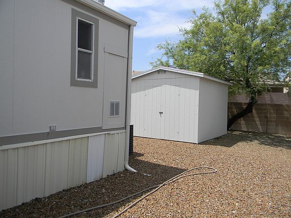 10x12 storage shed in back
