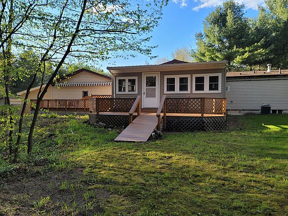 Rustic four season porch with gas fireplace. Ramp instead of steps to the yard on both decks.