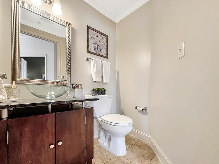 1/2 bathroom near the entrance of the property. Perfect for guest use