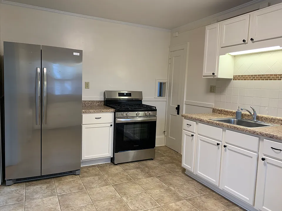 KITCHEN - brand new stainless steel refrigerator and gas stove/oven