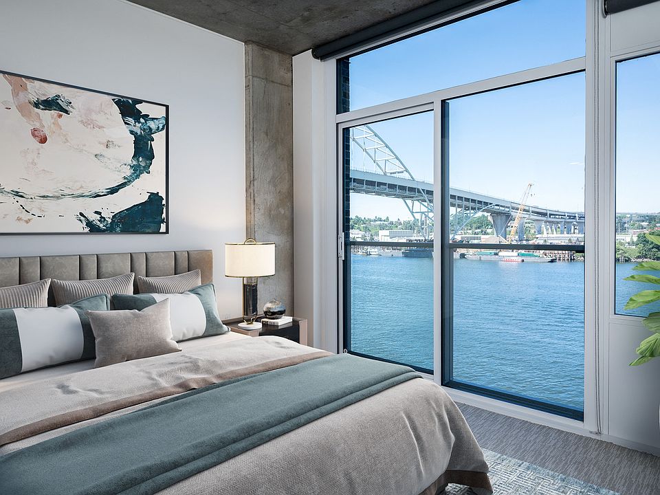 Beautifully designed interiors with high ceilings, oversized windows, and custom roller shades