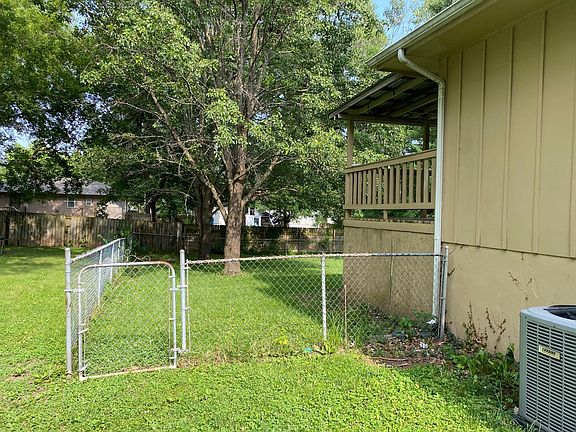 Covered deck and fenced yard