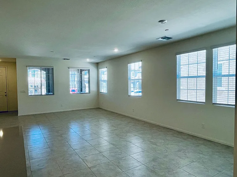 Spacious great room with upgraded designer tile and all window blinds
