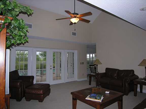 Family Room French Doors Open To Pool Lanai