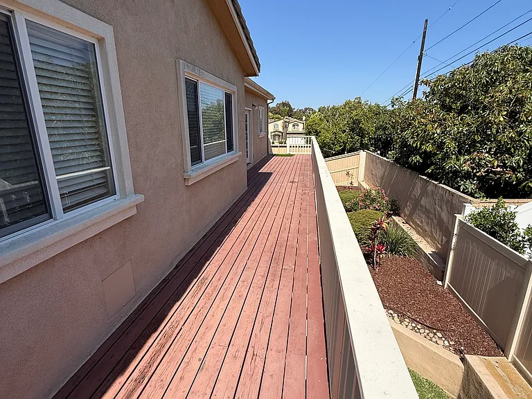 Deck runs full width of house
