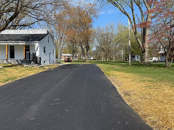 New double driveway and front side yard. Can easily fit 6 cars