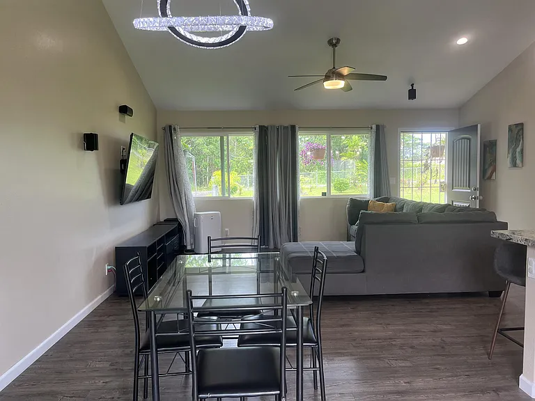 Dining table ideally situated between living area and kitchen