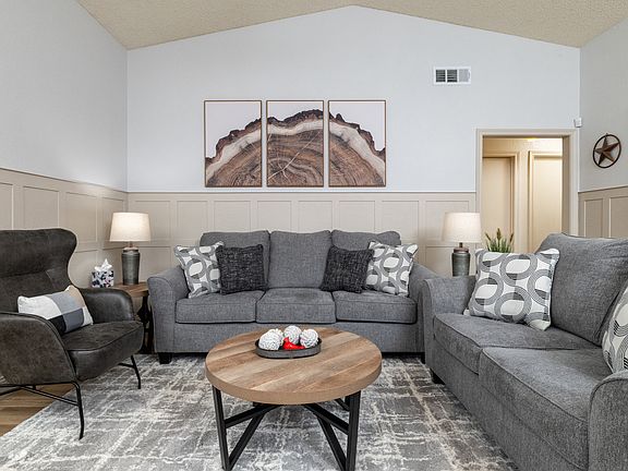 Spacious living room with extra pillows and blankets