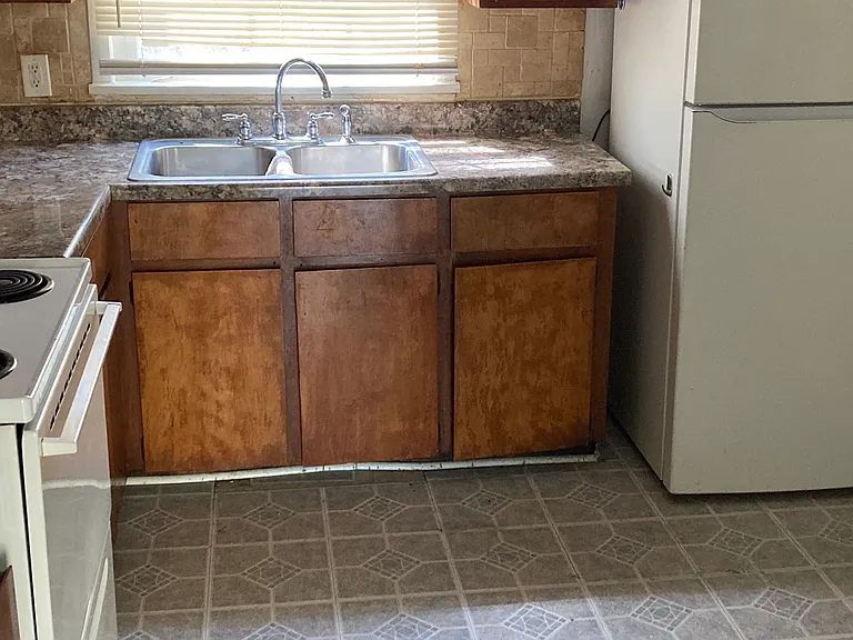Kitchen. 
Tile Backsplash
White appliances
New Range Hood
Electric Stove