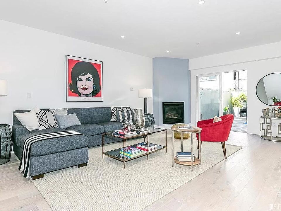 Spacious living room, exit to 600sf deck, and a gas fireplace.