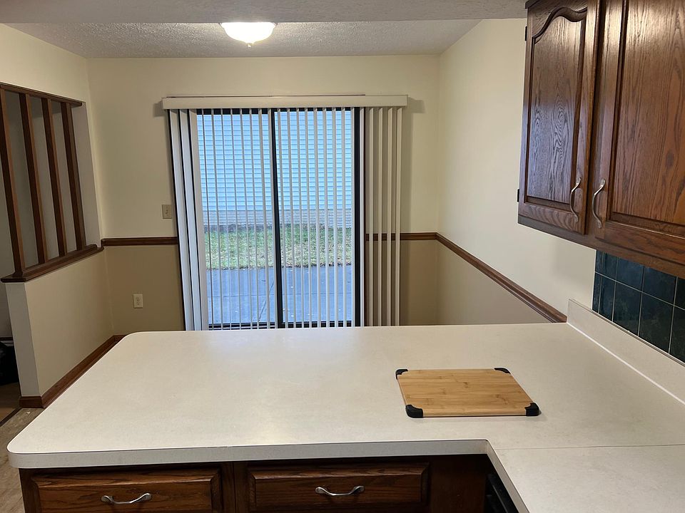 Kitchen view across dining area & patio