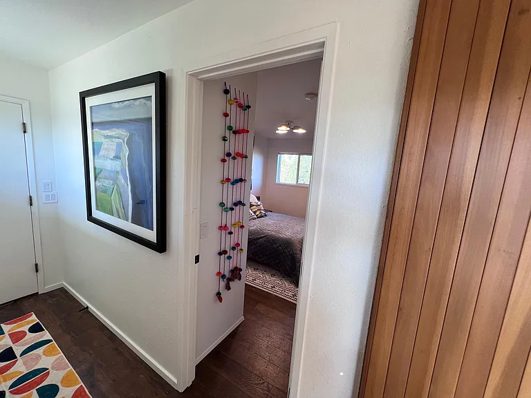 Entrance to the second bedroom, located on the first floor adjacent to the garage