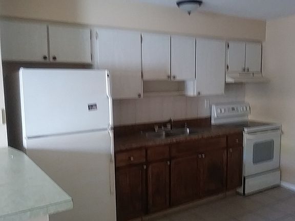 Kitchen has plenty of cabinets.