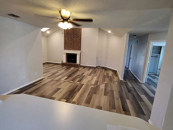 Looking at living room and dining room from breakfast room.