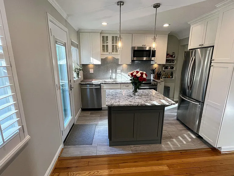 Stainless steel appliances with soft-close cabinets.
