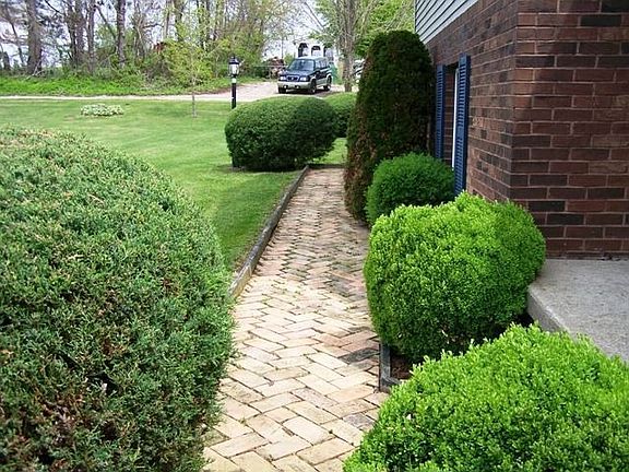 Paver walk with great landscaping.