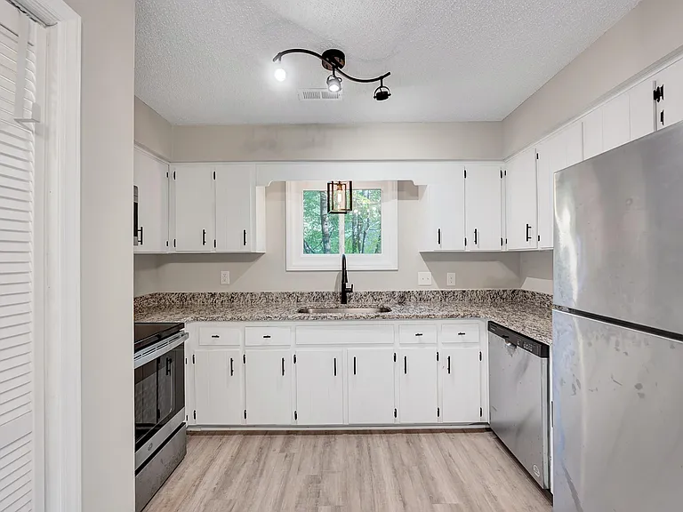 Kitchen with stainless steel appliances and granite