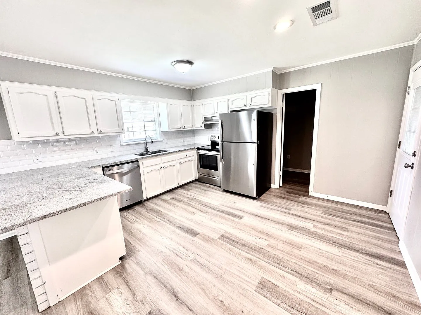 Bright & Spacious 3 Bedroom Brick Home with Double Carport & Large Backyard — Photo 2