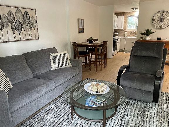 Living room flows into dining area and kitchen