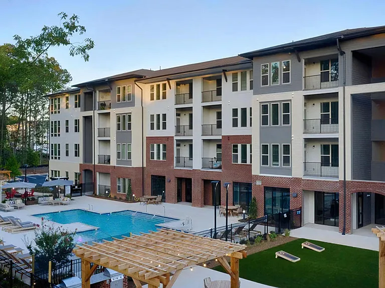 Broadstone Trailside Outdoor Amenity Deck Featuring Pool, Pergolas, and Lawn Games