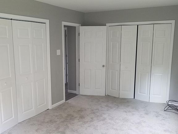 Bedroom with laundry in closet