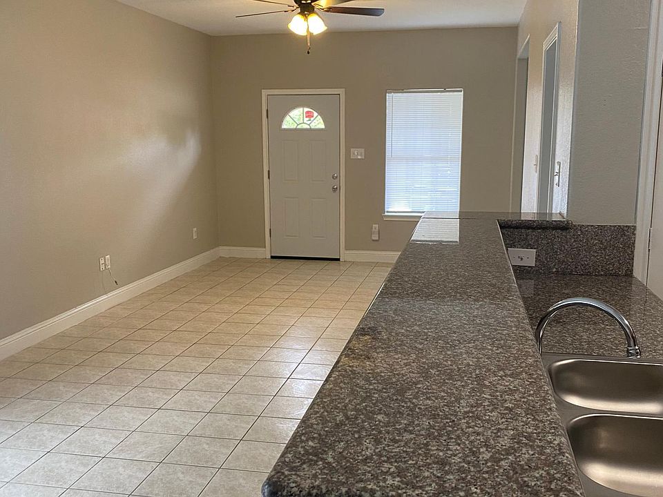 Open kitchen floorplan with granite counters and breakfast bar.