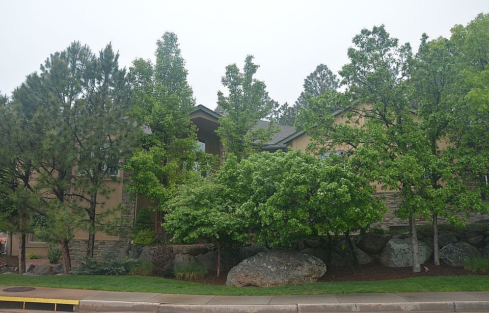 Front nestled in shade trees