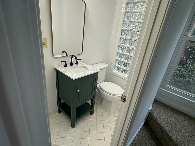 Newly updated half bath off of the living area