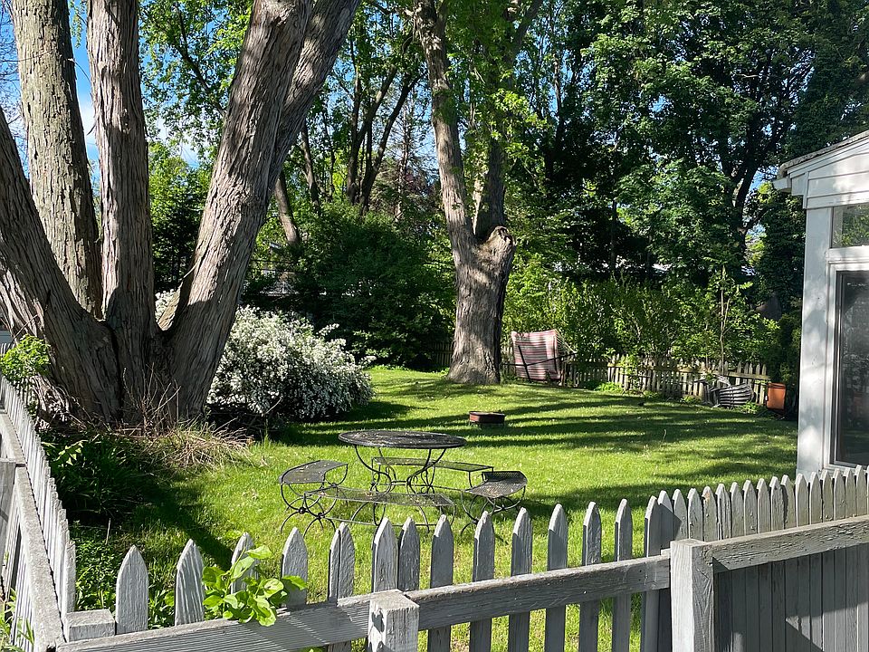 Large fenced in back yard with mature trees and plenty of space.