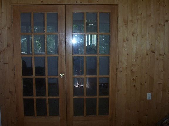 hand made notty pine toung and groofe wall on enclosed porch