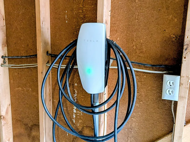 Electric car charging station in garage