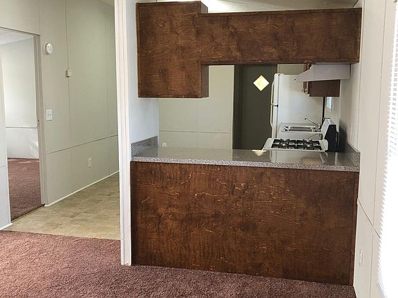 new carpet and new flooring in kitchen- kitchen open to family room.