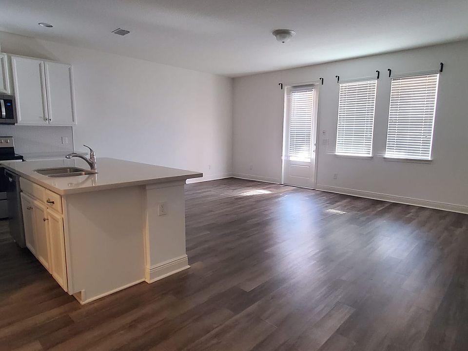Open FLorr with Windows and Backyard Door.