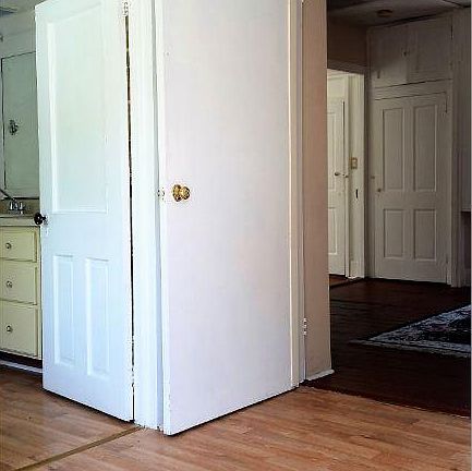 Through entrance way.  Bathroom on left.  Living Room ahead