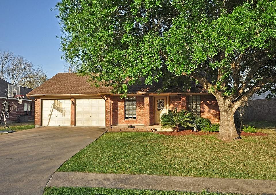 Great curb appeal with beautiful shade tree.