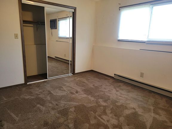 Bedroom with mirrored closet doors