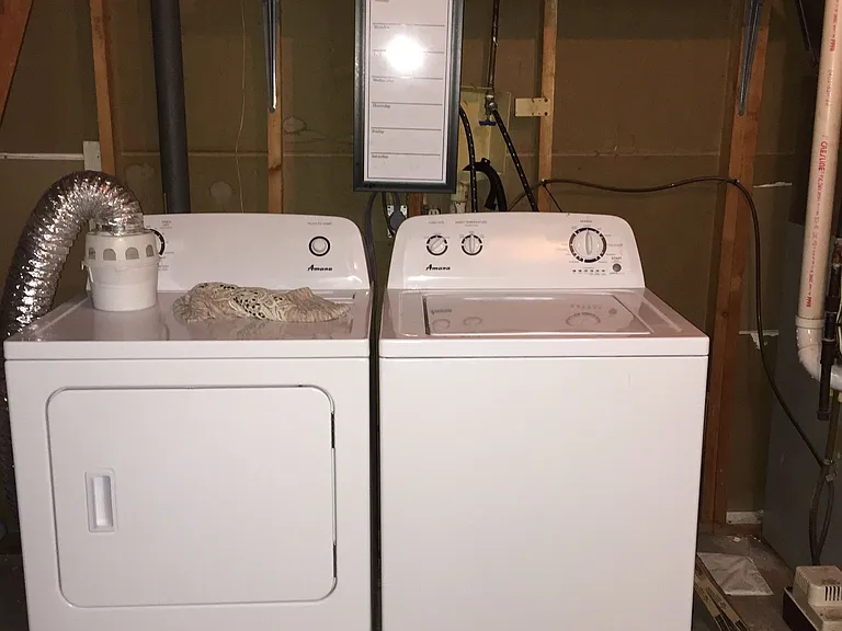 Additional storage is available in a shared basement room with a shared laundry.